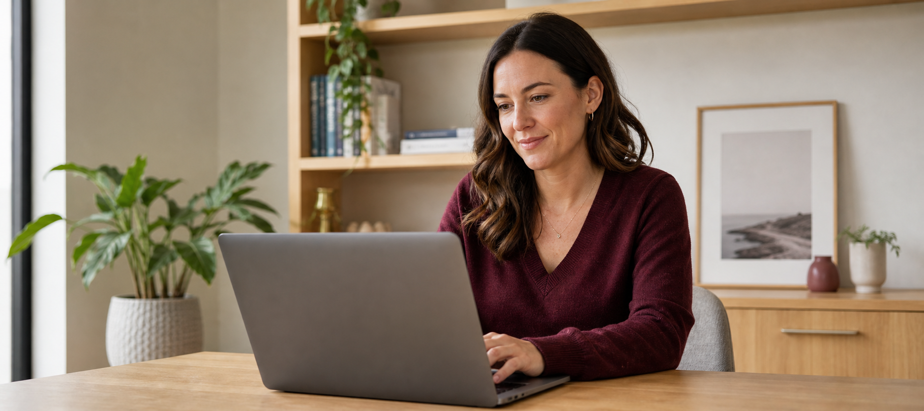 A homeowner reviewing refinance options on a laptop